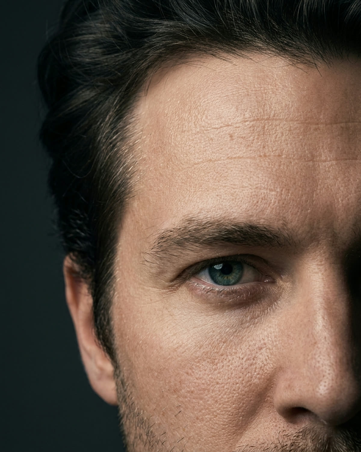 Close-up of a man's forehead showing early fine lines