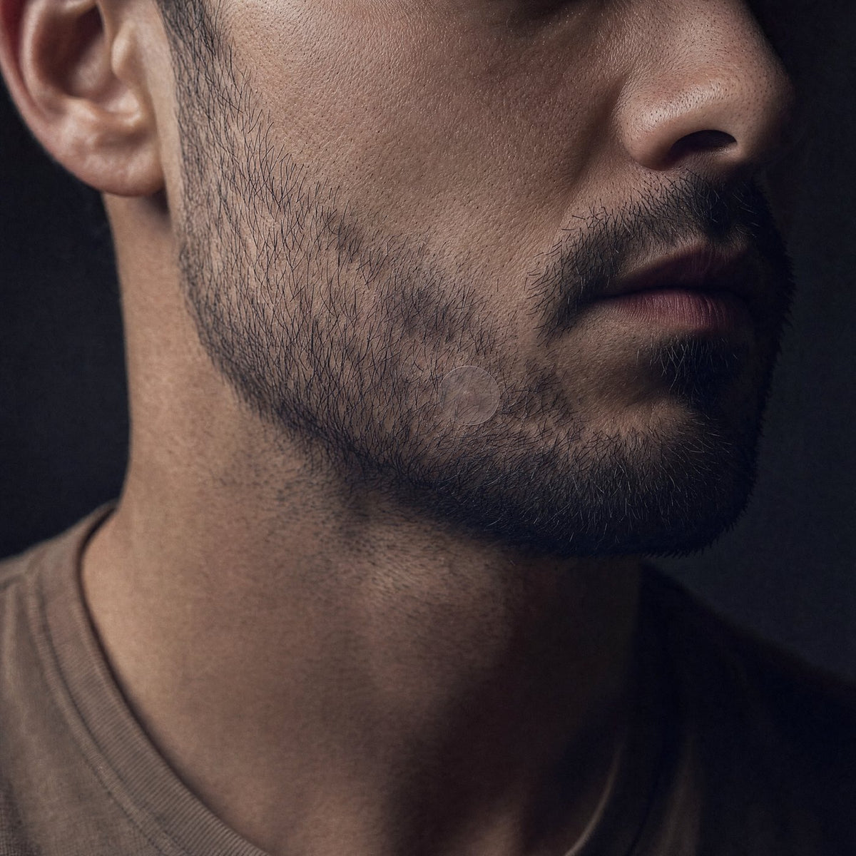 A hydrocolloid patch worn on the jaw, seen at close range
